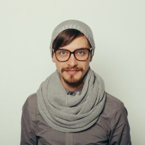 portrait of an interesting young man in winter clothes.jpg